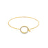 A sleek gold bangle bracelet features a sparkling pavé diamond-encrusted circular clasp with a delicate hook closure against a clean white background.