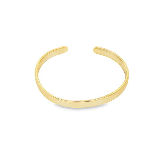 A sleek gold cuff bracelet rests against a clean white background, showcasing its polished open-ended design.