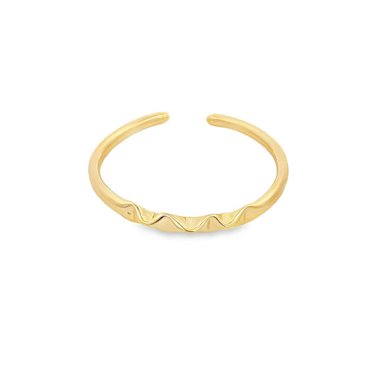 A minimal gold ring features a delicate, wavy design along the front band.