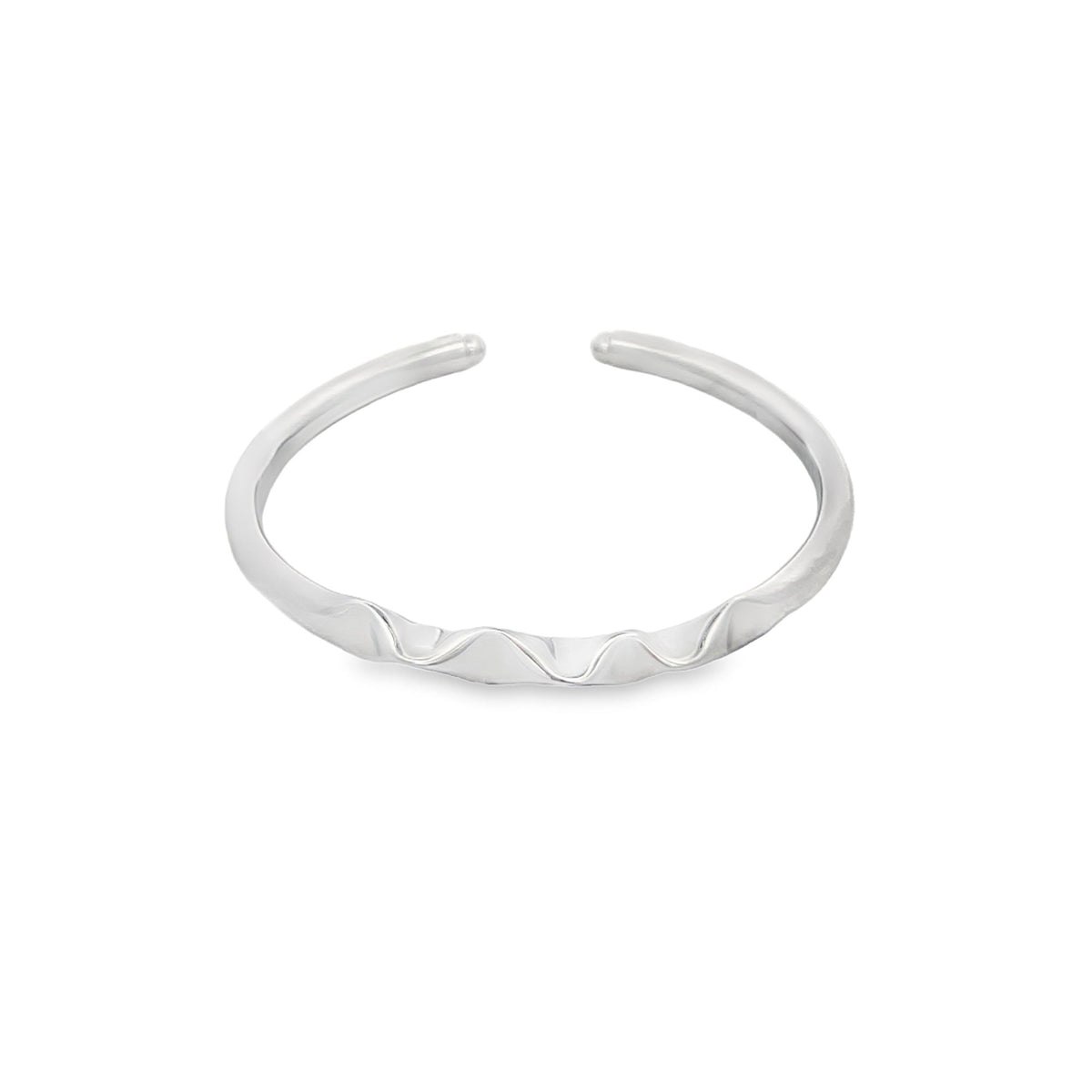 A minimalist silver ring featuring an open band with a delicate, wavy design rests against a clean white background.