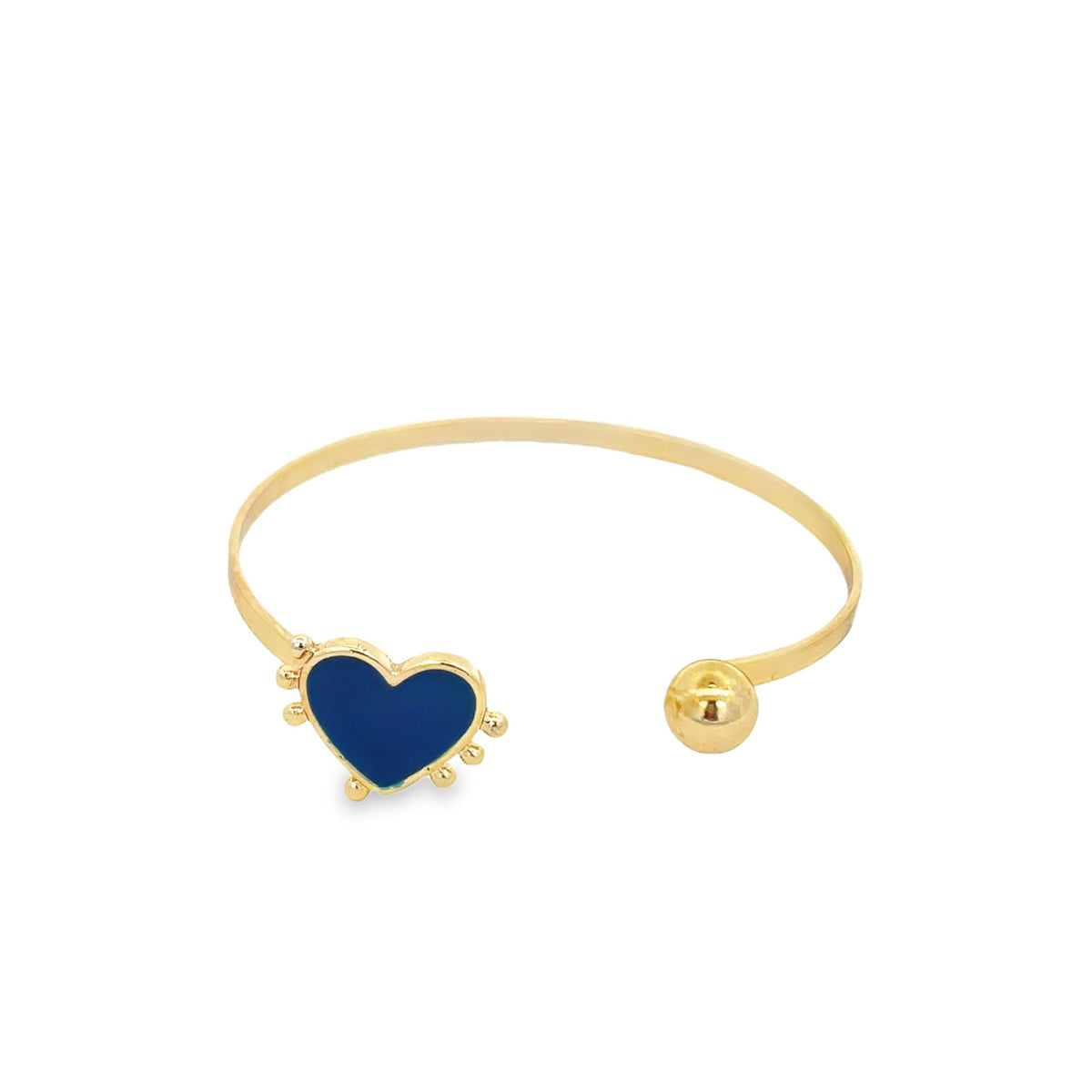 A sleek gold cuff bracelet features a blue enamel heart charm at one end and a polished gold sphere at the other.