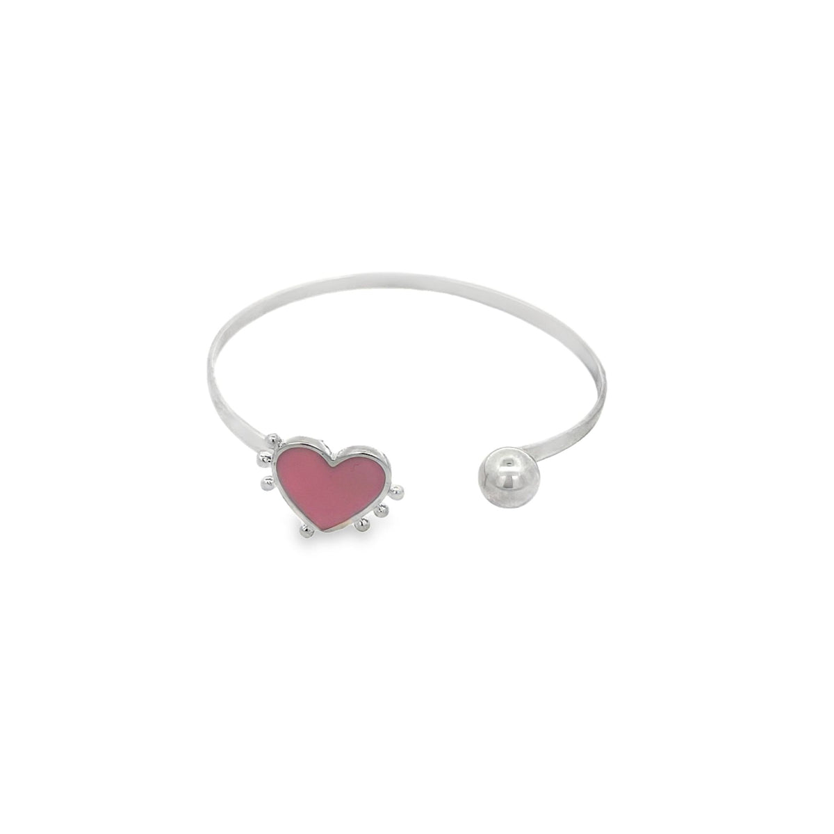 A sterling silver open bangle bracelet features a pink enamel heart charm on one end and a polished ball bead on the other.