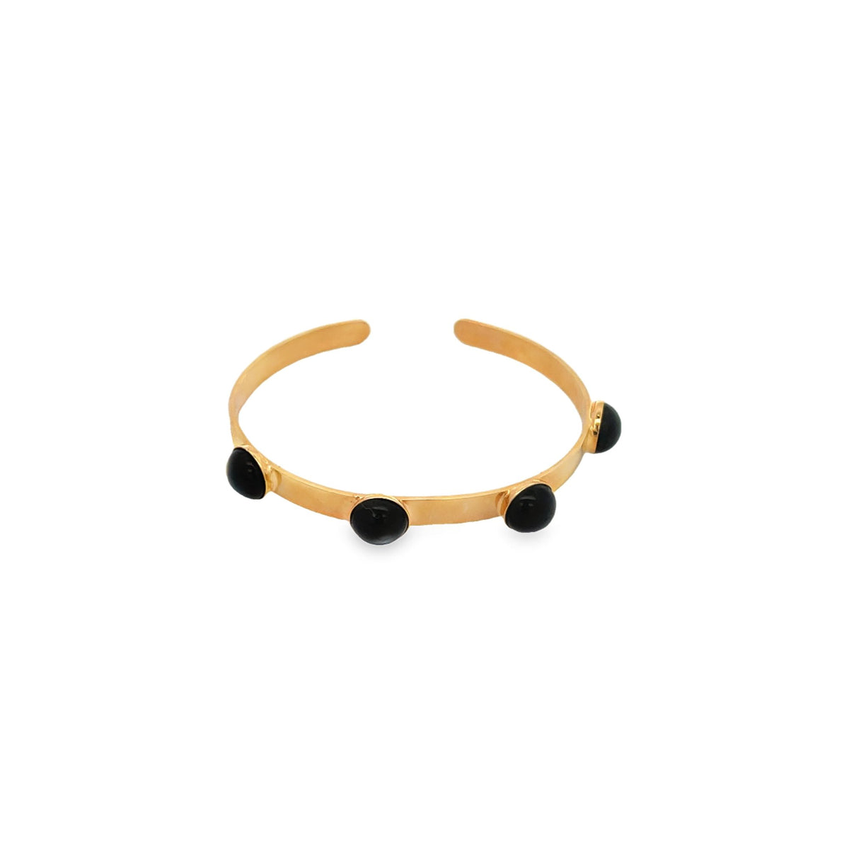 A gold open cuff bracelet features four smooth black stone cabochons evenly spaced along its band.