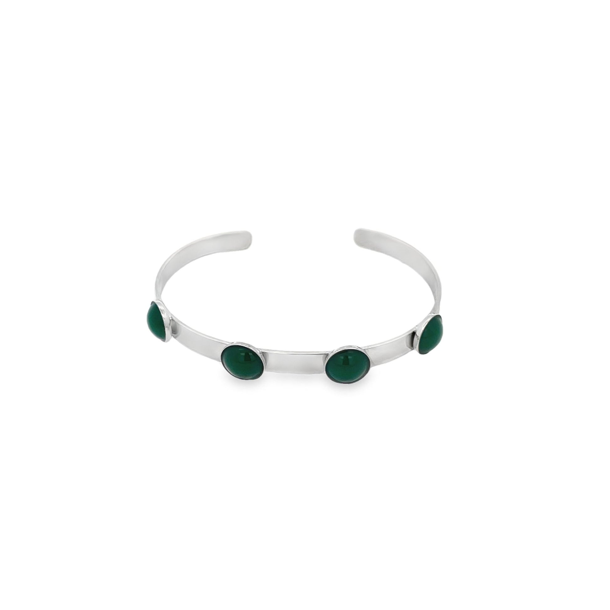 A sleek silver cuff bracelet features four round, polished green gemstones bezel-set along its band.