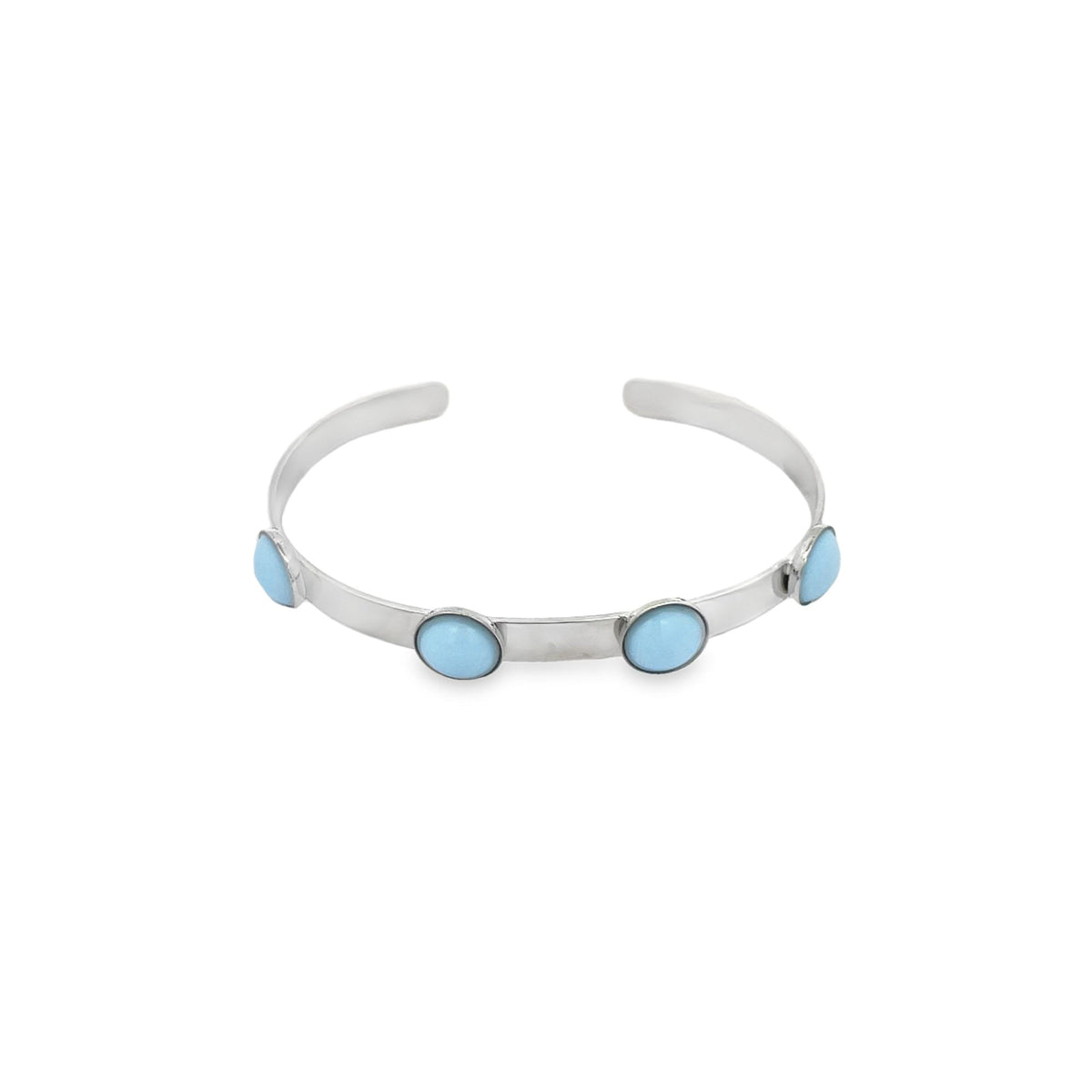 A silver cuff bracelet features four round light blue stones evenly spaced along the metal band against a plain white background.