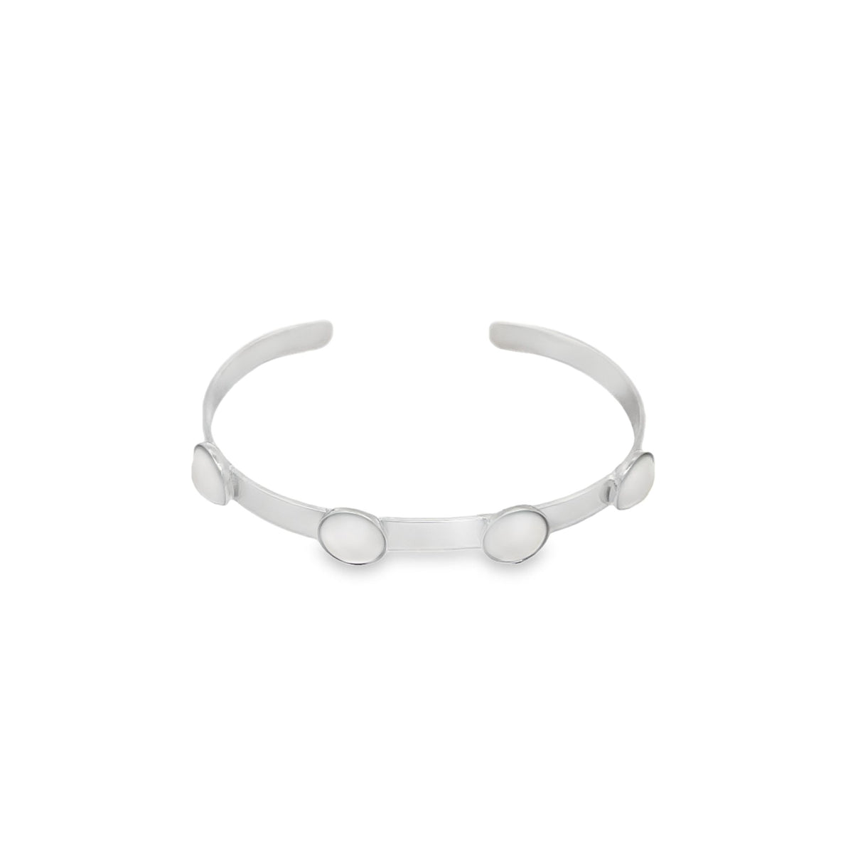 A sleek silver cuff bracelet features four round, mother-of-pearl cabochons spaced evenly along its polished band against a clean white background.