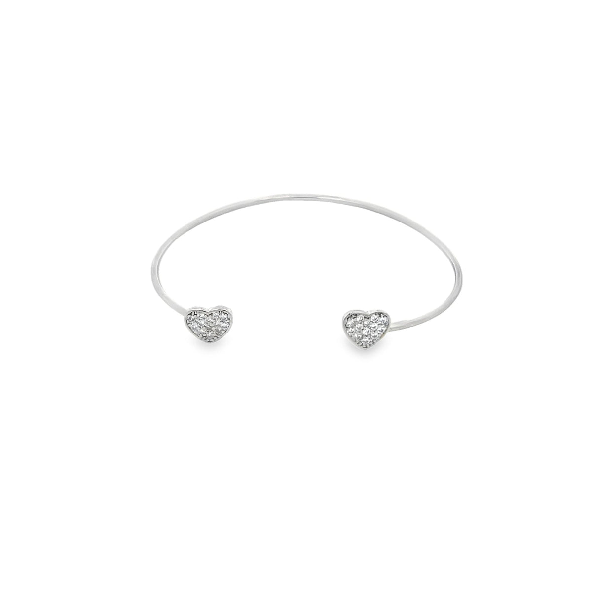 A silver cuff bracelet features sparkling pave-set crystal hearts at each open end against a clean white background.