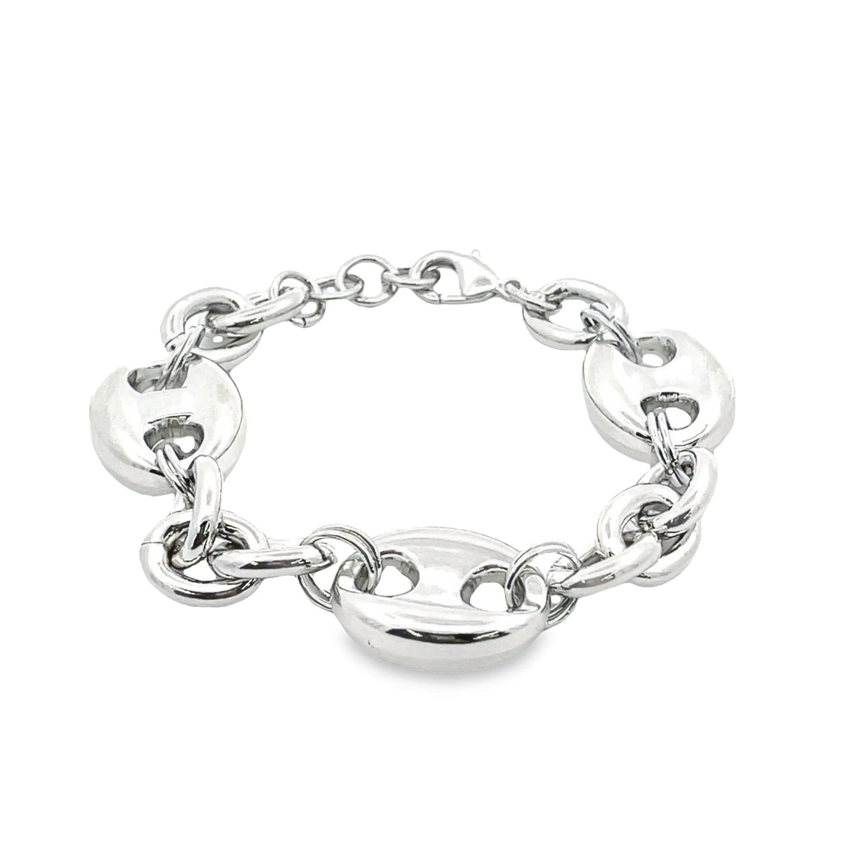A polished silver Mariner link bracelet lies on a clean white surface, showcasing its chunky nautical-inspired design.