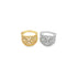 A gold ring and a silver ring with intricate filigree designs and sparkling cubic zirconia stones rest side by side on a white surface.
