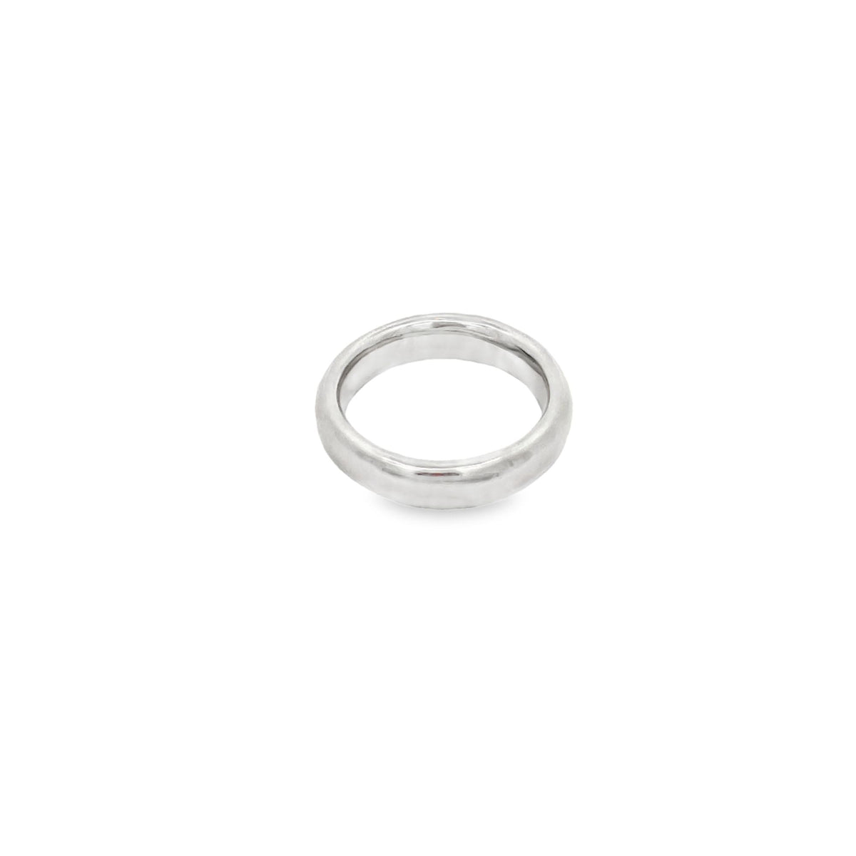 A sleek white gold band ring rests centrally on a clean white background.