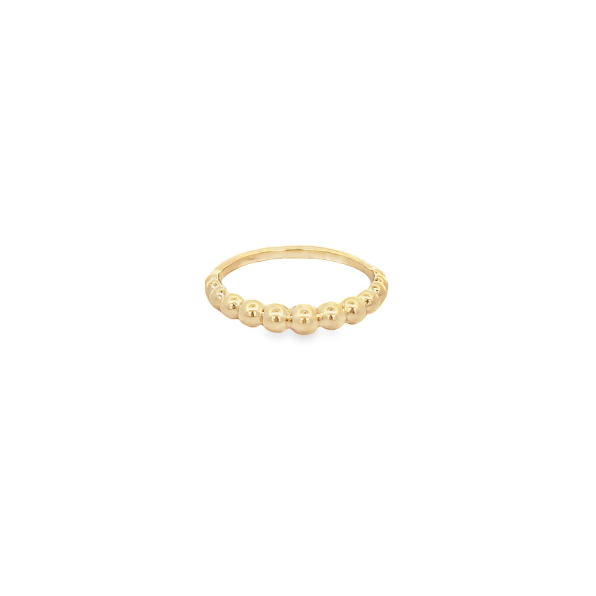 A delicate gold beaded ring rests against a clean white background.