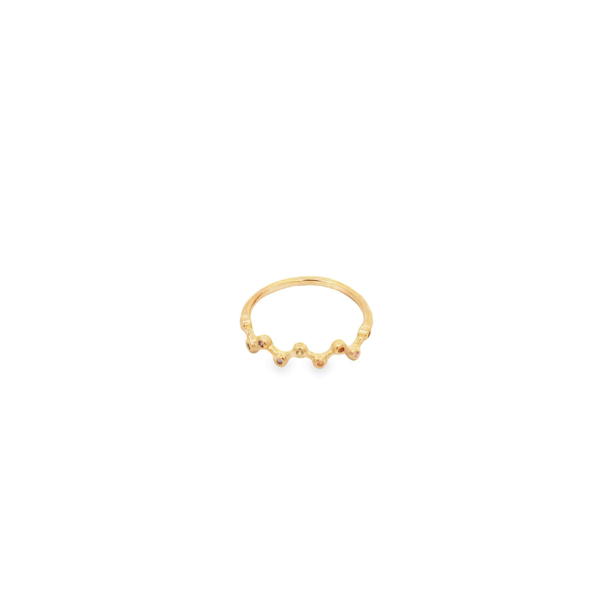 A dainty gold ring features a wavy band accented with small colorful gemstones against a clean white background.