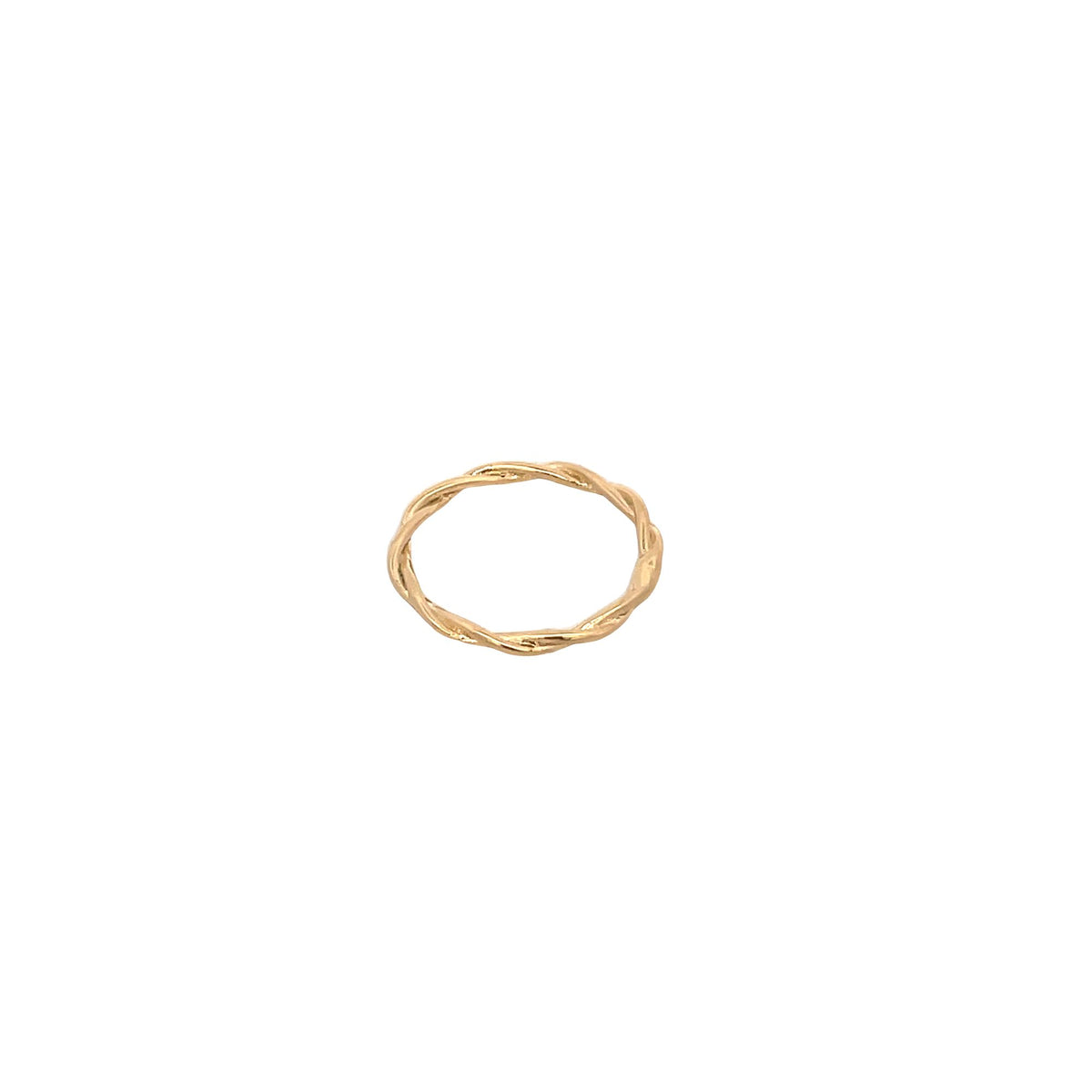 A minimalist gold twisted band ring rests against a clean white background.