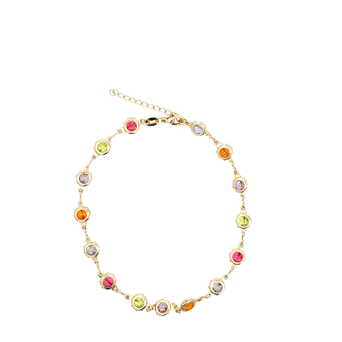 A gold-toned chain anklet features bezel-set multicolored gemstones arranged in a circular shape against a white background.