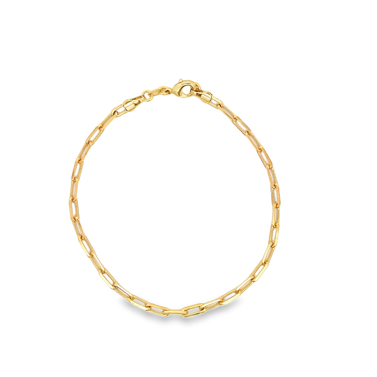 A shiny gold paperclip chain bracelet rests in a circle on a white background, featuring a secure lobster clasp.