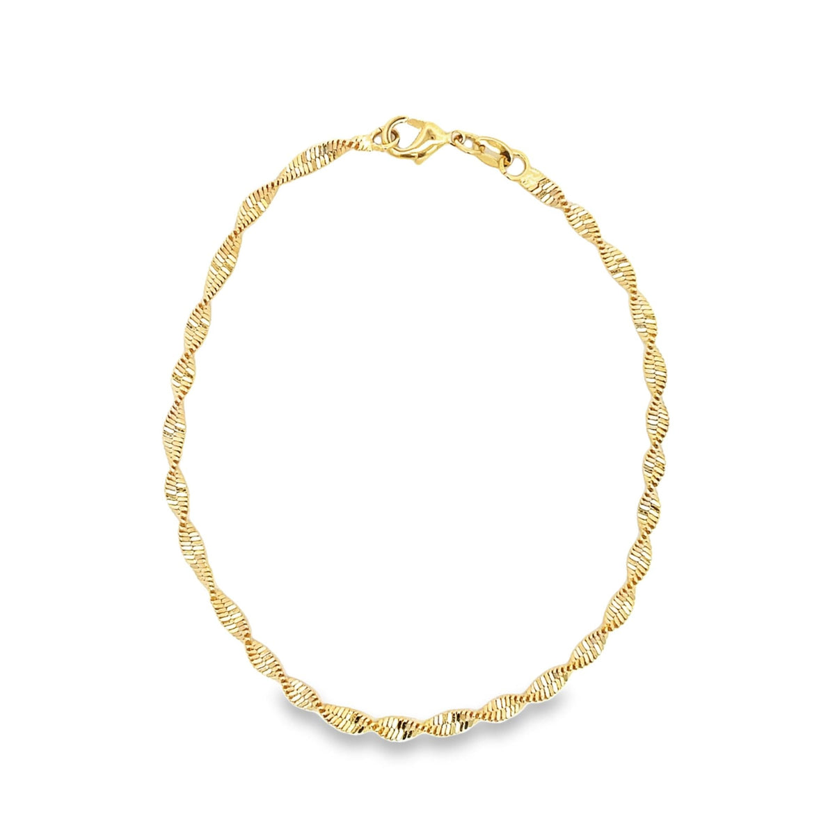 A delicate gold herringbone chain necklace curves gracefully against a clean white background.