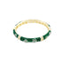A gold bangle bracelet features vibrant green enamel and delicate flower motifs set with sparkling diamonds.