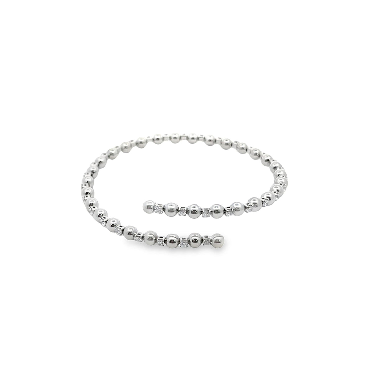 A white gold beaded diamond bypass bracelet curves gracefully on a clean white background.
