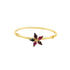 A gold bangle bracelet features a delicate flower-shaped centerpiece adorned with multicolored gemstone petals.