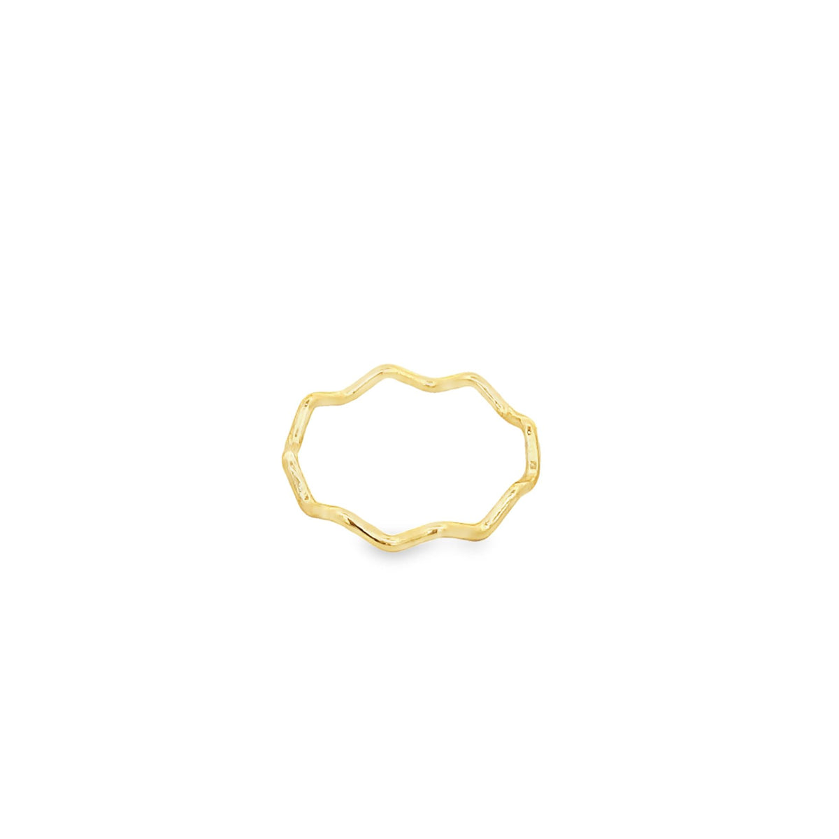 A minimalist gold wavy band ring rests against a clean white background.