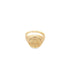 A gleaming gold signet ring displays an intricate Saint Benedict medal engraving on its face.