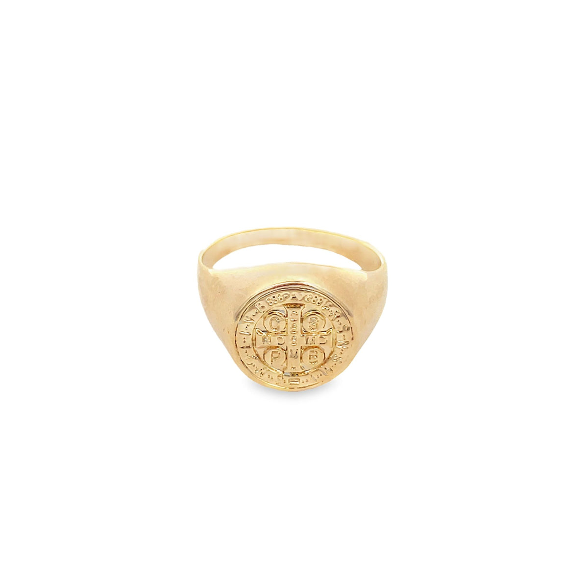A polished gold Saint Benedict signet ring displays its detailed circular medal face against a clean white background.