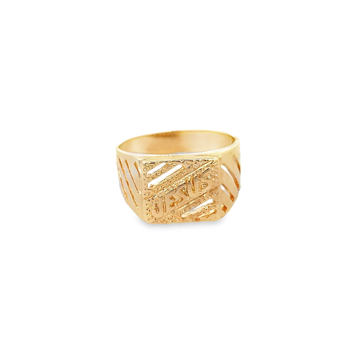 A gold signet ring features an intricate cutout design displaying the word "Jesus" across the front.