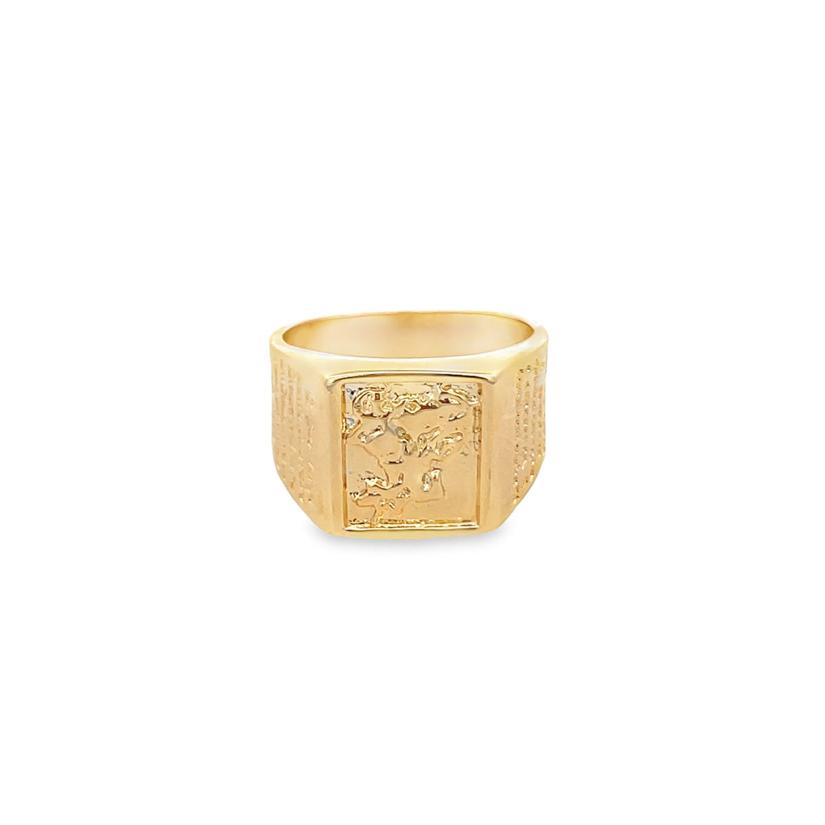 A polished gold signet ring features an intricate, textured rectangular face and detailed engraving along the band.