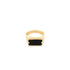A gold ring features a rectangular black stone set in the center against a white background.