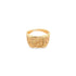 A gold signet ring features an intricate Celtic knot pattern engraved across its flat top and sides.