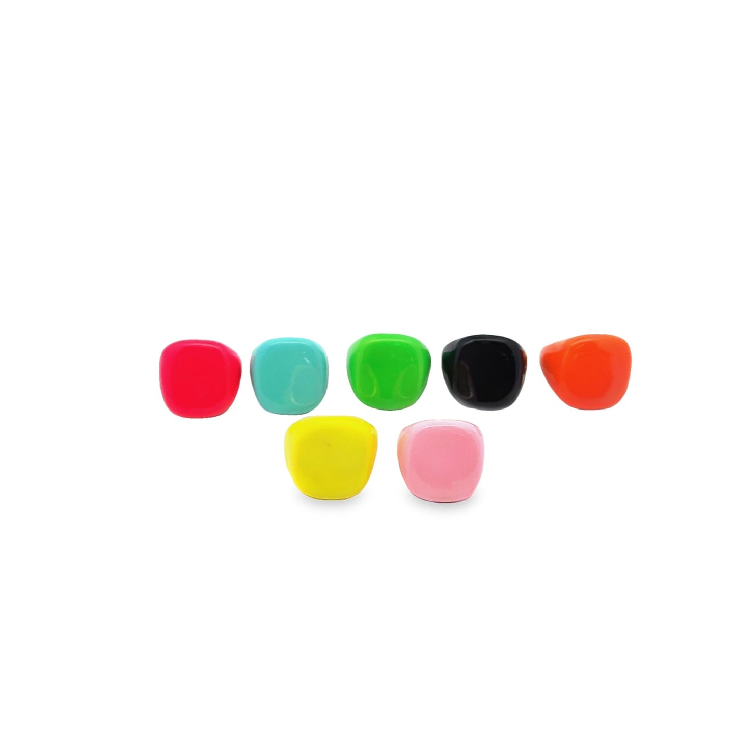 A colorful collection of chunky resin rings displays vibrant shades of red, turquoise, green, black, orange, yellow, and pink against a clean white background.