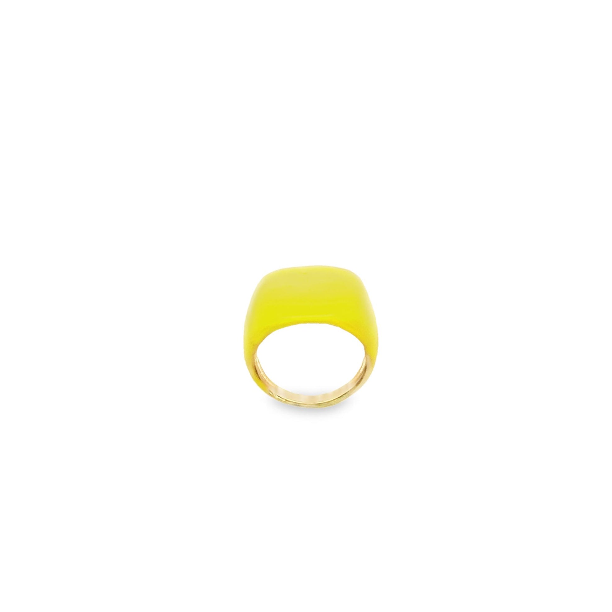 A bold gold ring features a smooth, vibrant yellow enamel top set against a clean white background.