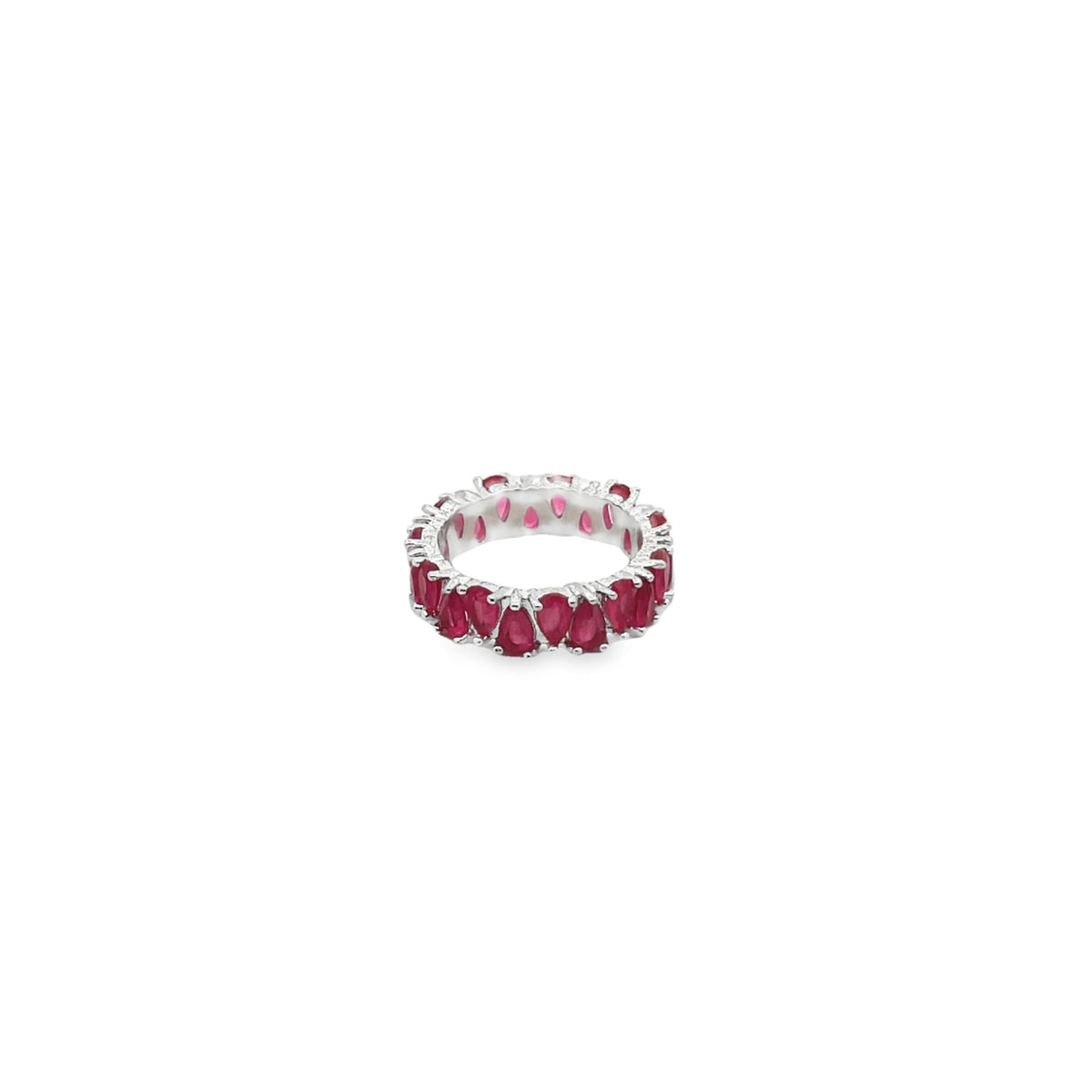 A silver eternity band features vibrant pear-cut rubies set all the way around the ring.