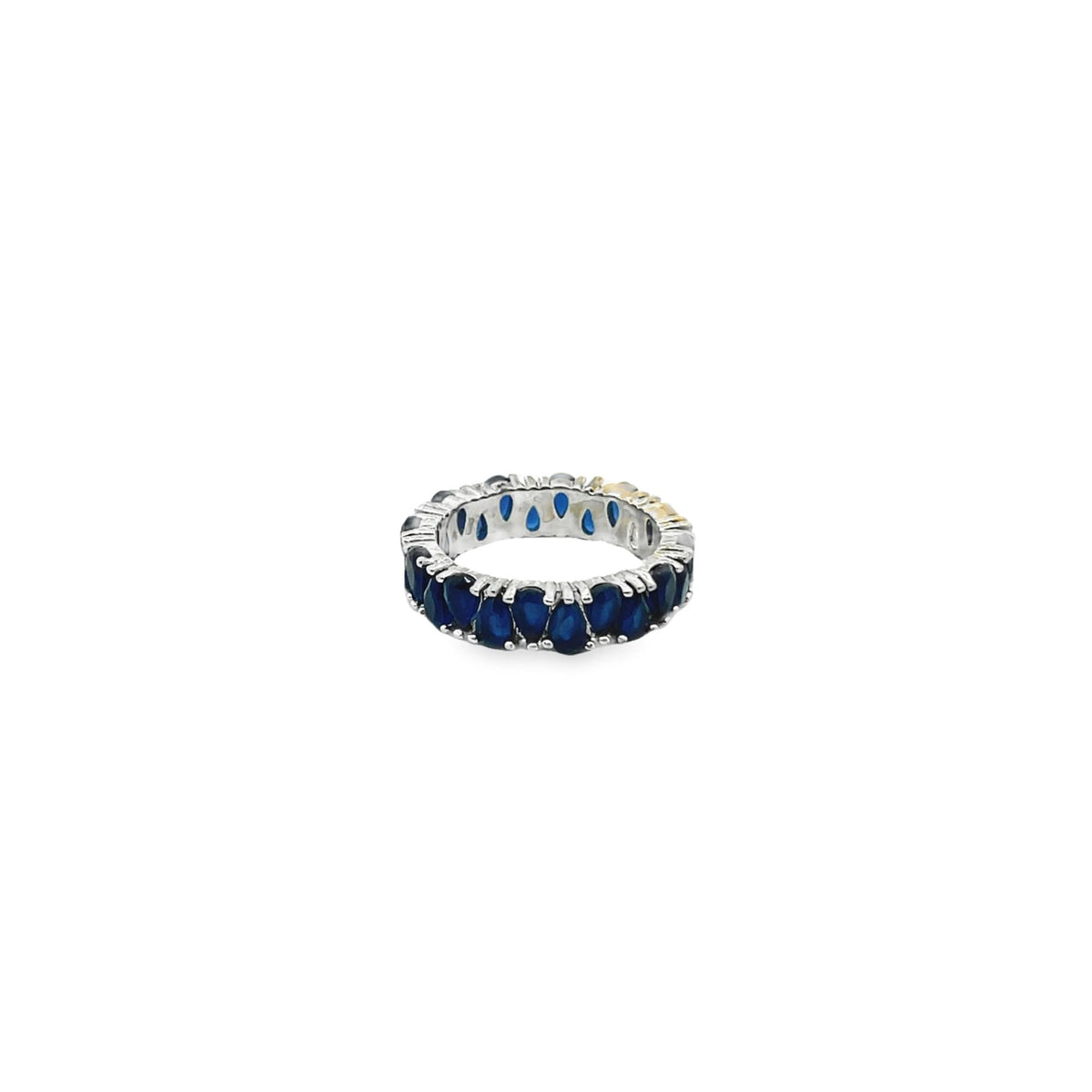 A silver eternity ring features a continuous band of prong-set pear-cut blue sapphires.