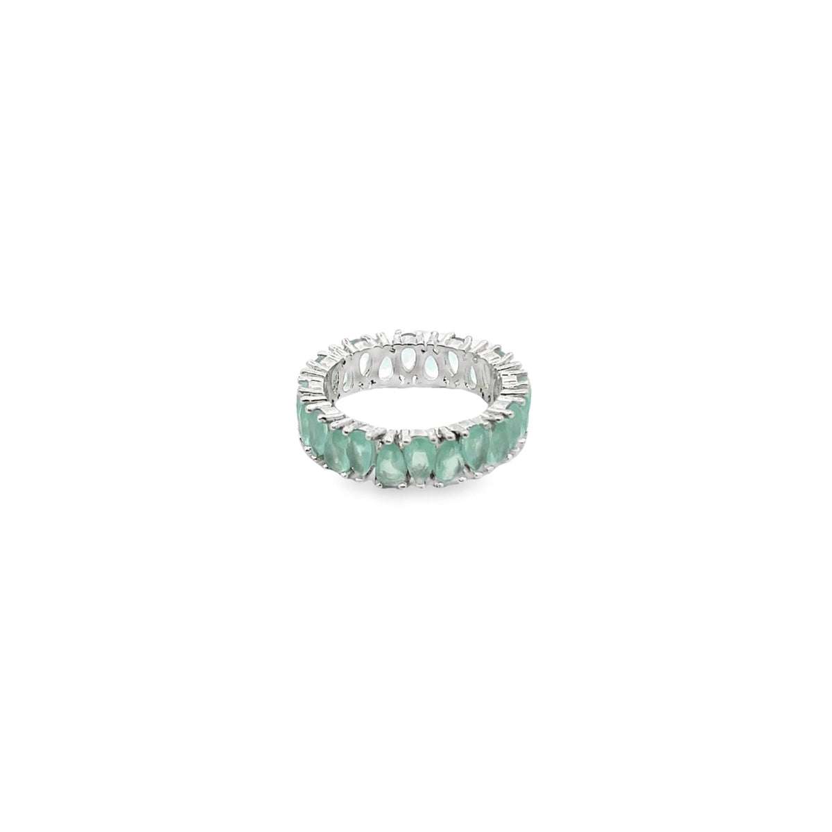 A silver eternity band features a continuous circle of prong-set, pear-cut green gemstones against a white background.