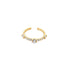 A delicate gold ring sparkles with a row of embedded cubic zirconia crystals against a plain white background.