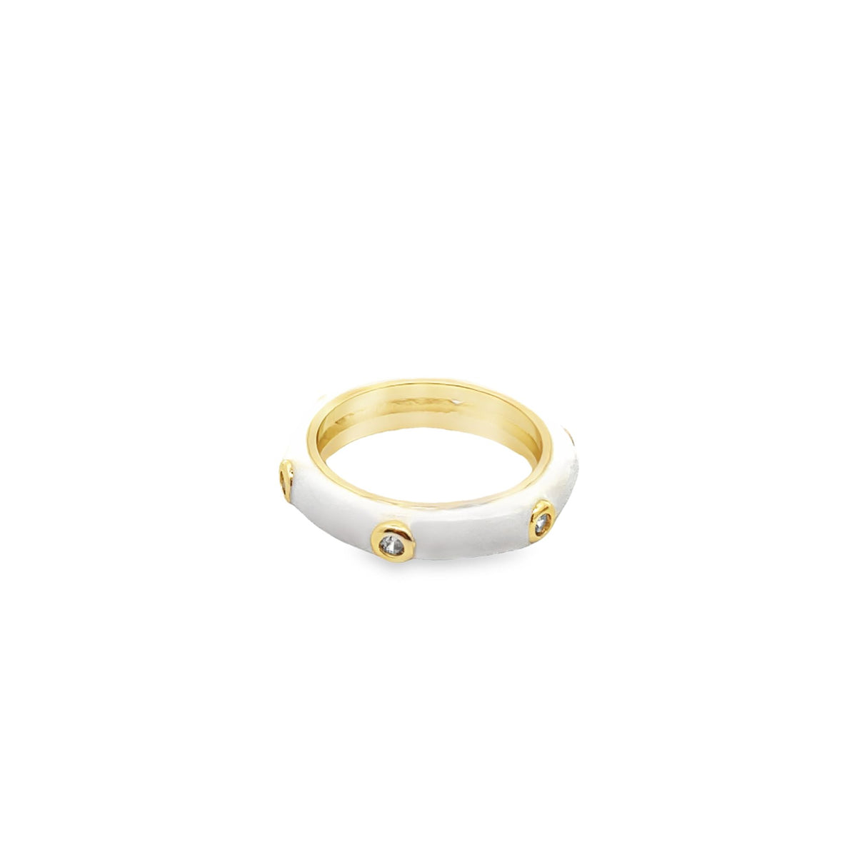 A gold ring features a white enamel band accented with sparkling inset crystals.