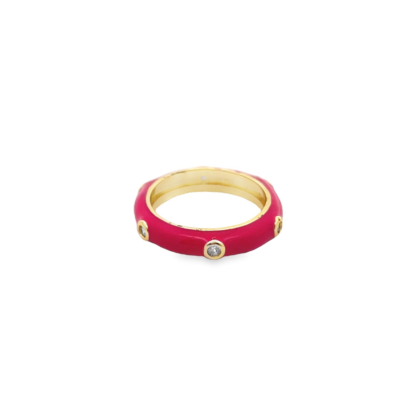 A vibrant pink enamel ring features inlaid sparkling crystals set in gold against a clean white background.