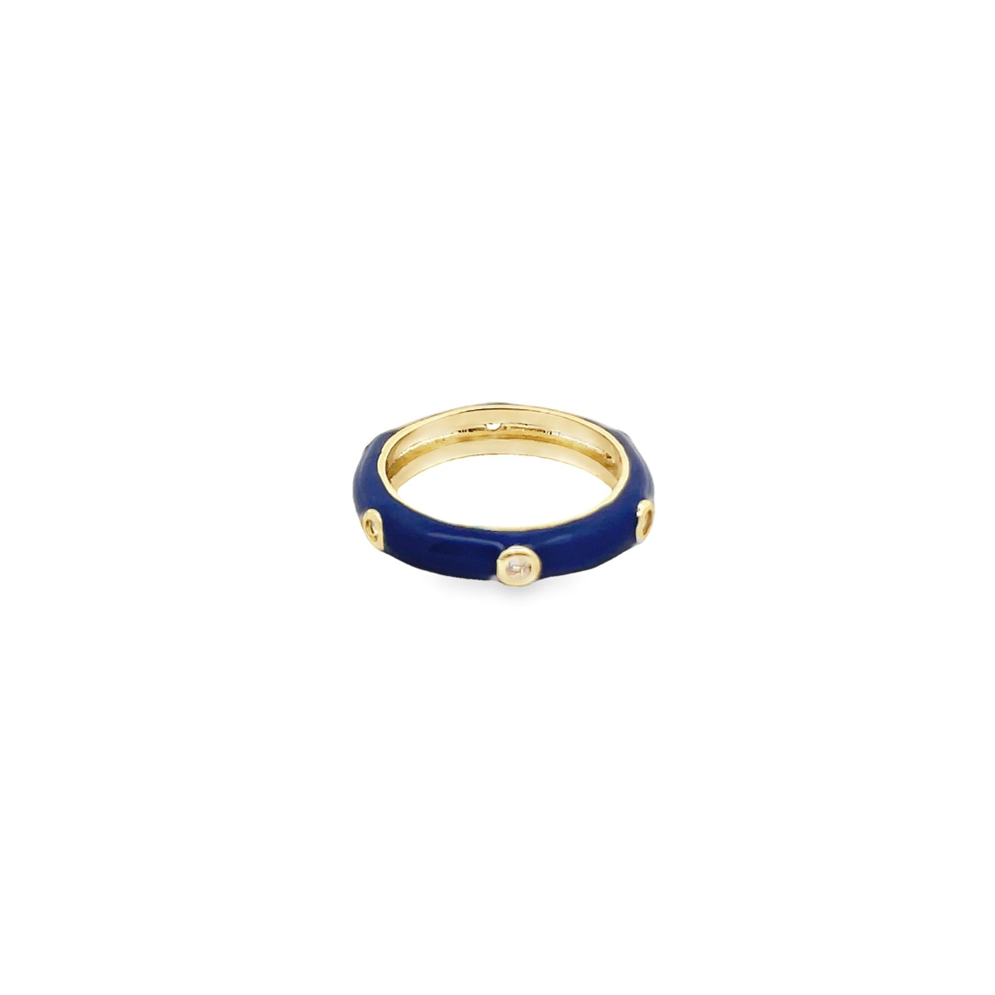 A gold ring features dark blue enamel inlay and sparkling bezel-set diamonds.