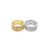 A gold ring and a silver ring featuring intricate lattice work and sparkling pave-set cubic zirconia stones sit side-by-side on a white background.