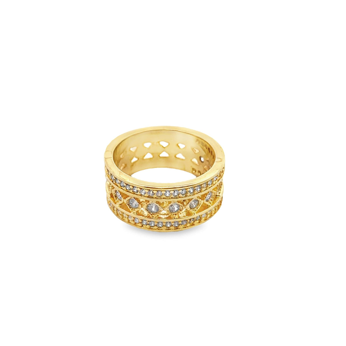 A detailed gold ring features sparkling crystal embellishments and intricate filigree cutouts.