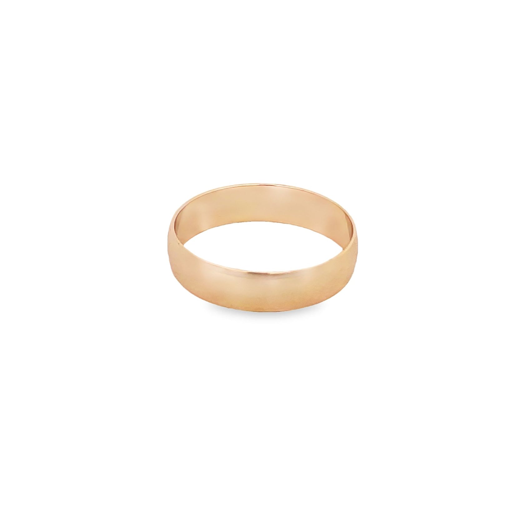 A smooth rose gold band ring rests on a clean white background.