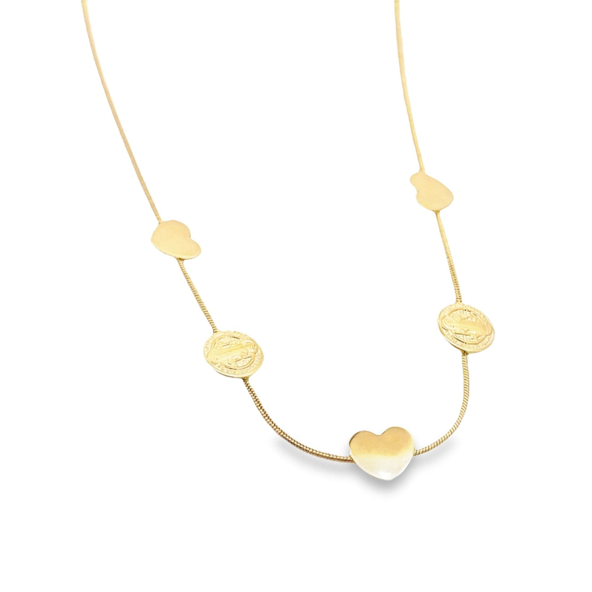A delicate gold chain necklace dangles against a white background, featuring alternating heart charms and circular medallion pendants.