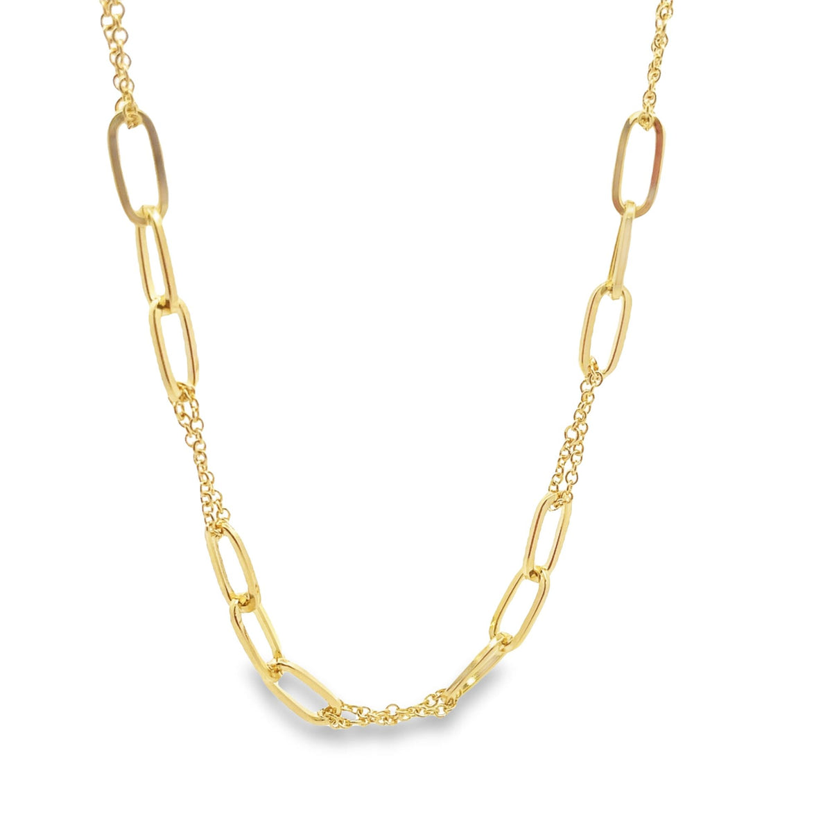 A gold paperclip link necklace displays a unique mixed-chain design against a plain white background.