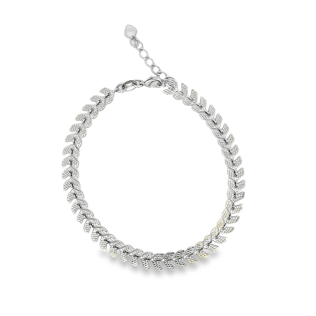 A silver herringbone chain anklet features a textured, chevron-patterned design with an adjustable extender chain and a lobster clasp.