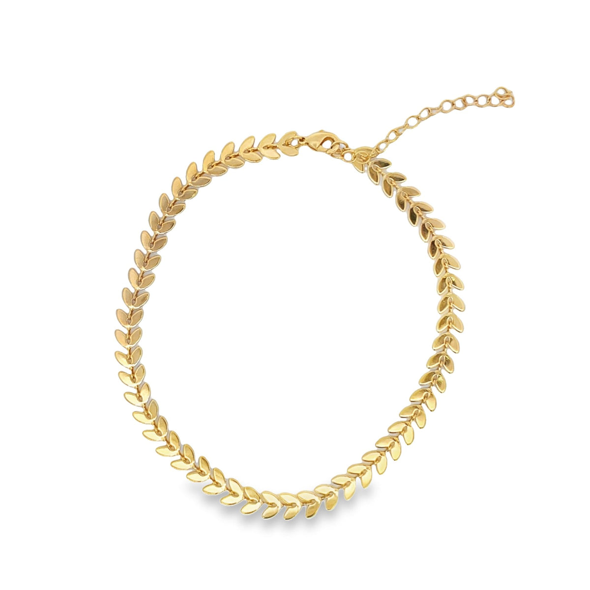 A delicate gold leaf choker necklace displays an intricate botanical design against a clean white background.