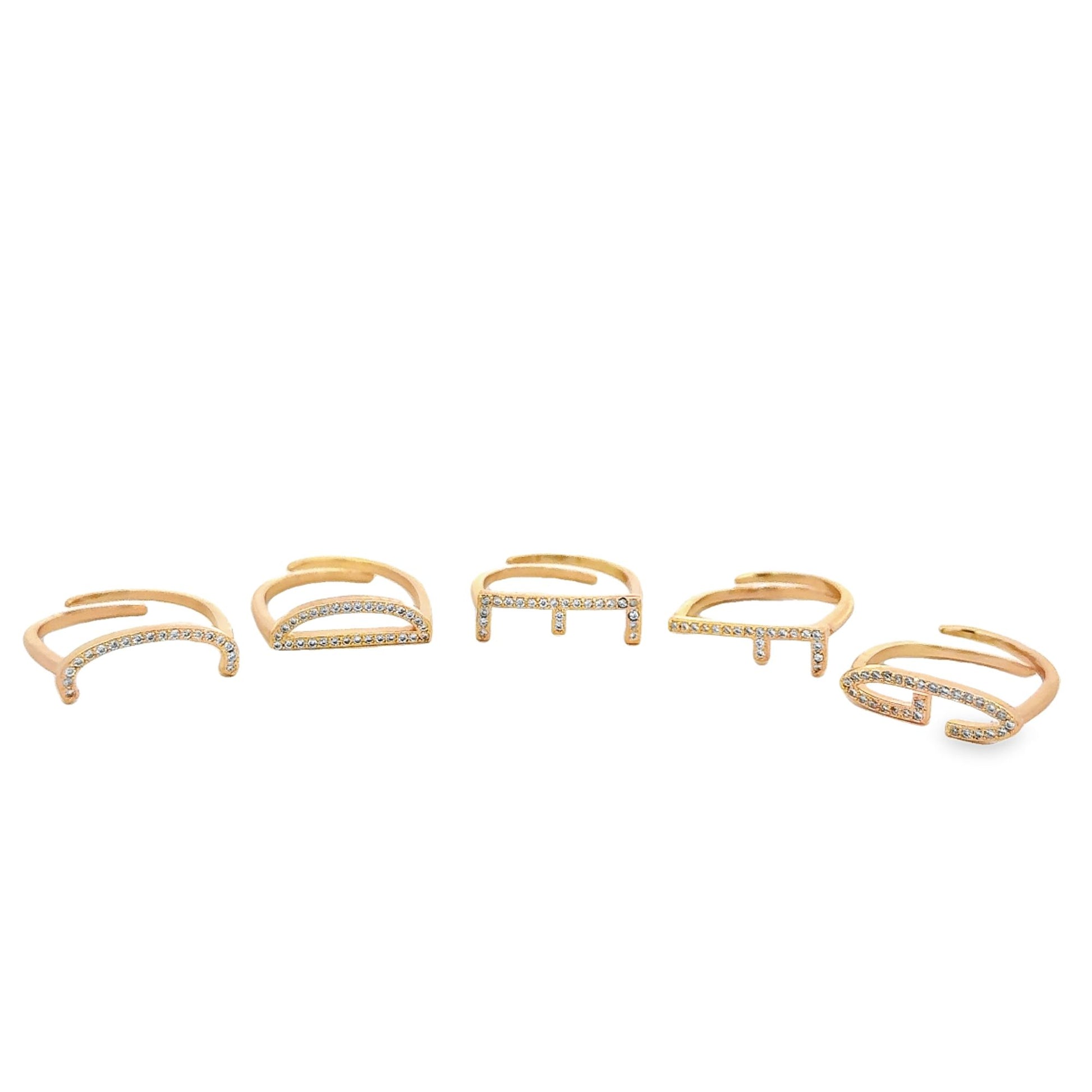 Five gold geometric rings encrusted with small diamonds are displayed in a row on a white background.