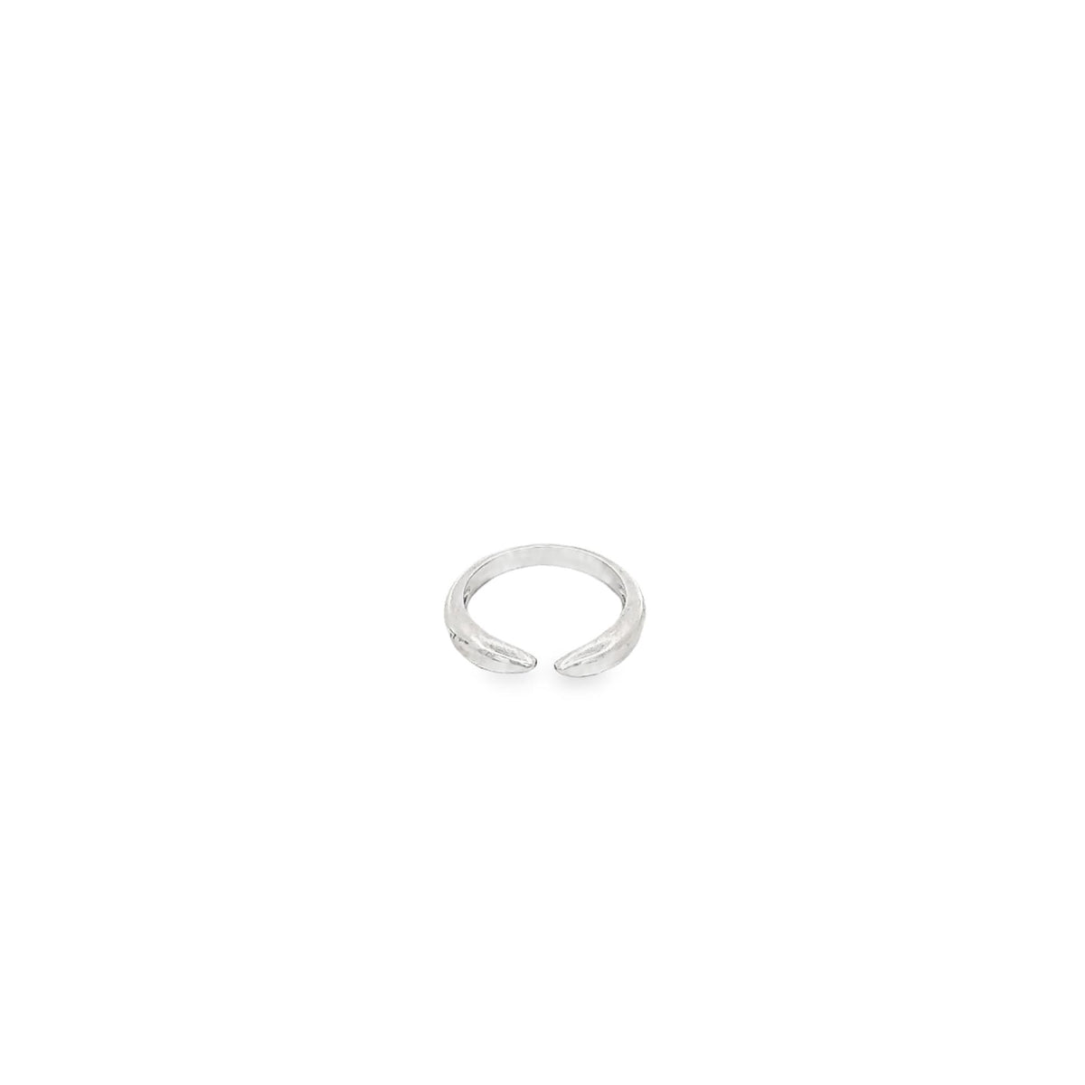 A minimalist silver open band ring rests against a clean white background.