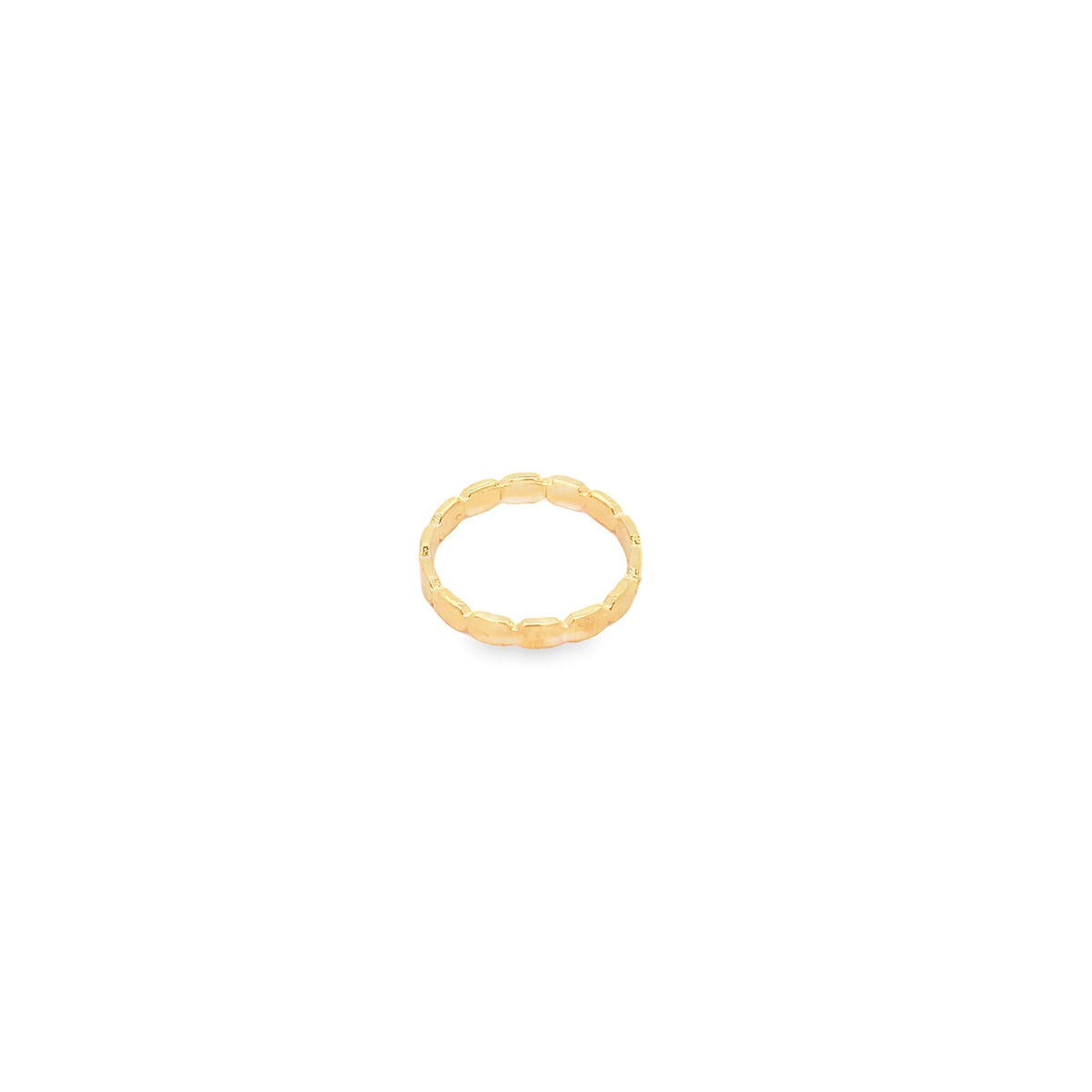 A sleek gold textured band ring sits centered on a clean white background.