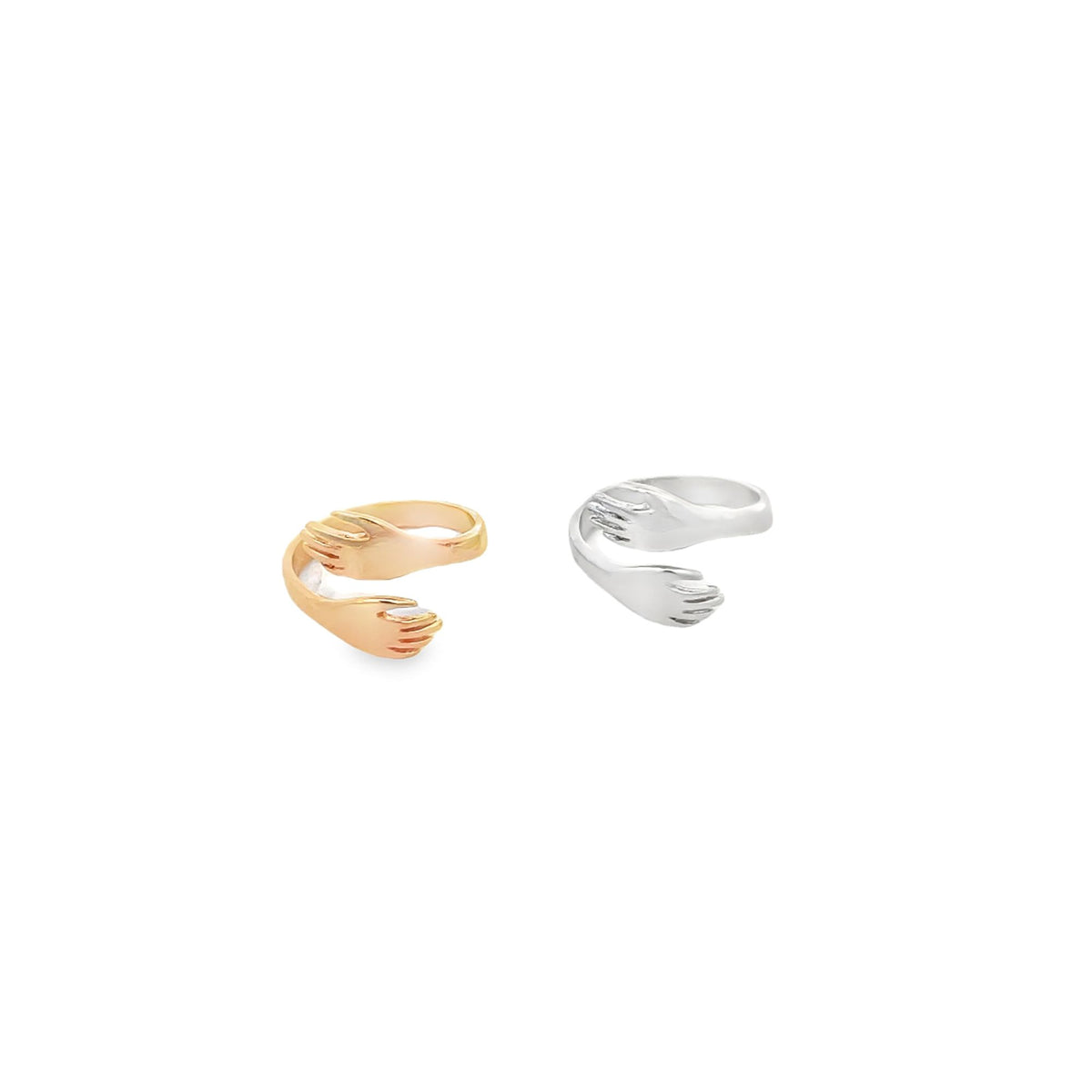 A rose gold and a silver hug ring display their hands-wrapped-around band design against a plain white background.
